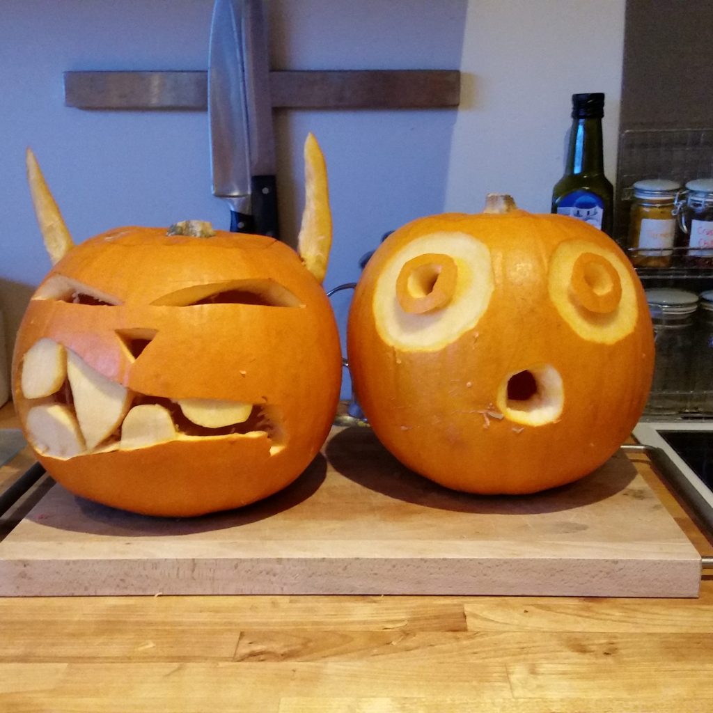 Two pumpkins that were carved for Halloween