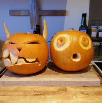 Two pumpkins that were carved for Halloween